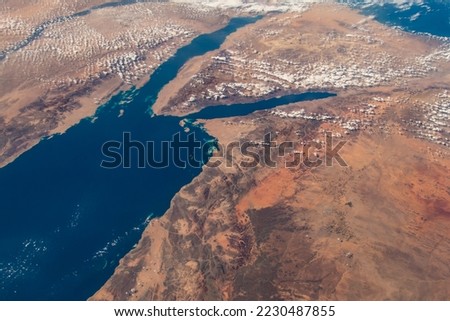 Aerial view of the northern Red Sea in Saudi Arabia. Digitally enhanced. Elements of this image furnished by NASA. Royalty-Free Stock Photo #2230487855