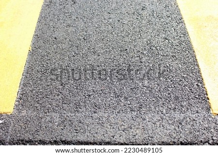 asphalt road surface  Asphalt is mainly used in the construction or repair of roads or walkways.