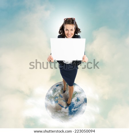 Top view of businesswoman holding white blank banner. Elements of this image are furnished by NASA