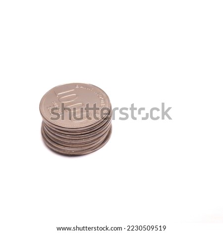 pile of Indonesian rupiah coins, isolated background.