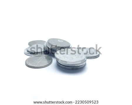 pile of Indonesian rupiah coins, isolated background.