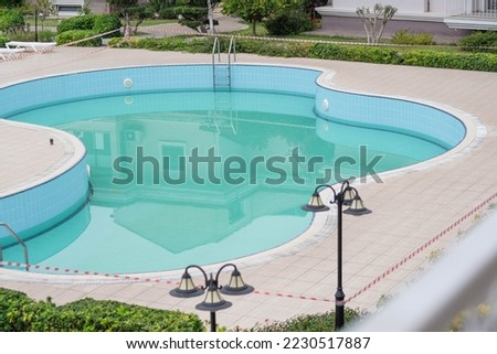 lowered swimming pool in a residential complex Royalty-Free Stock Photo #2230517887