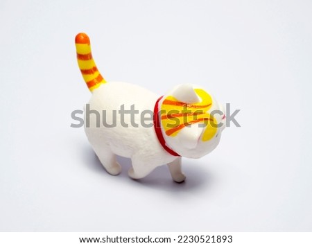 small cat doll on white background