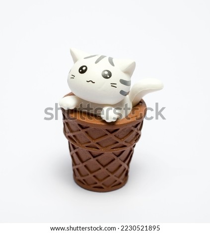 small cat doll on white background