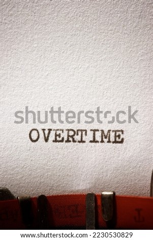 Overtime word written with a typewriter.