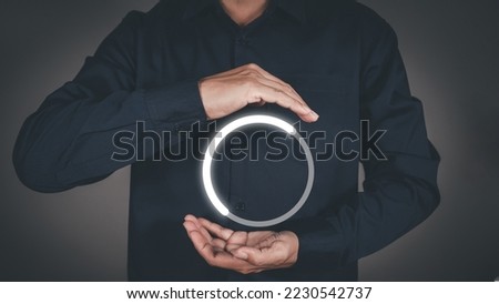 Man with glowing loading circle digital interface.  Royalty-Free Stock Photo #2230542737