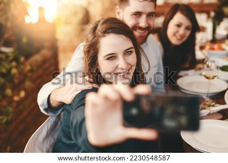 Selfie, happy and friends at dinner party, lunch celebration and reunion at restaurant. Smile, people and taking photos on smartphone at social gathering with food, eating and young group together