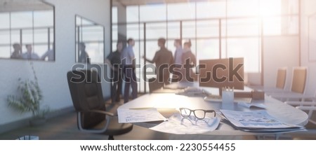 financial chart near dollars seen by unfocused glasses, colleagues meeting in office only silhouettes being viewed