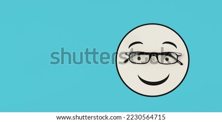 Head with a smiling face and eyeglasses, mental health concept, positive mindset, support and evaluation symbol 