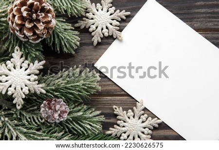 Christmas background with fir tree and decor on old wooden background background. Top view with copy space