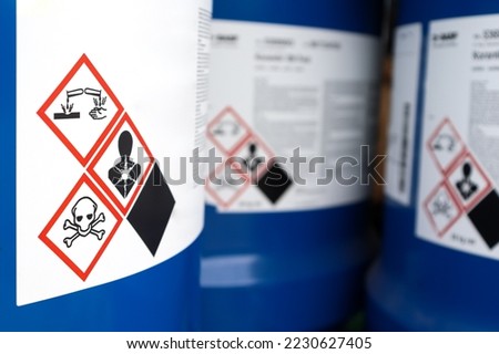 Warning symbol on the chemical bottle , hazardous chemicals in the industry Royalty-Free Stock Photo #2230627405