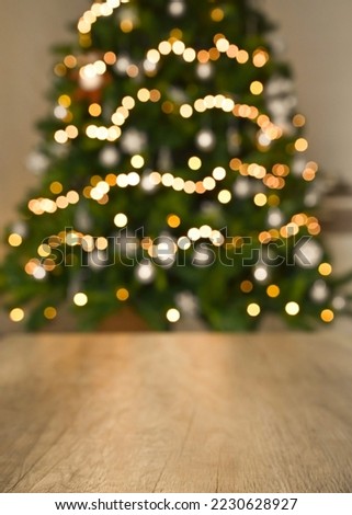  Blurred background without focus with bokeh.
Christmas table background with christmas tree bokeh.