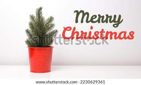 Minimalistic banner with Merry christmas text near cute christmas tree