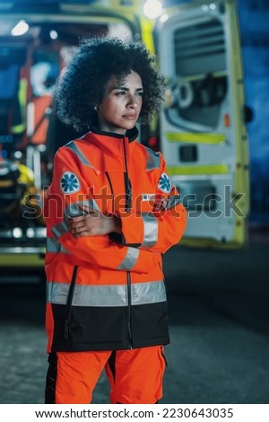 Vertical Photo: Portrait of Beautiful, Multiethnic, Female Paramedic Specialist on Late Night Shift. Heroic Empowering Woman Seriously Looking Away and posing for Camera, Reporting for Duty Royalty-Free Stock Photo #2230643035