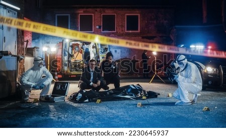 Female Police Officer and Male Investigator Working as a Team on Solving a Murder Case at the Crime Scene. Professional Investigation Team Looking Through Patterns in the Evidence to Break the Case Royalty-Free Stock Photo #2230645937