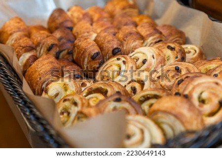 A lot of sweet pastries in baskets on the buffet table. Business breakfasts and catering at events. Close-up. Royalty-Free Stock Photo #2230649143
