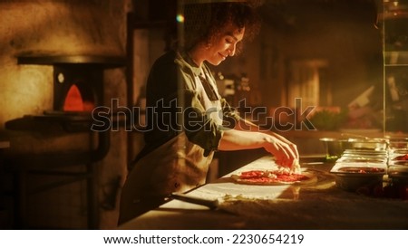 In Restaurant Professional Female Chef Preparing Pizza, Adding Ingredients, Special Sauce, Cheese, Traditional Family Recipe. Authentic Italian Pizzeria, Cooking Organic Food Royalty-Free Stock Photo #2230654219