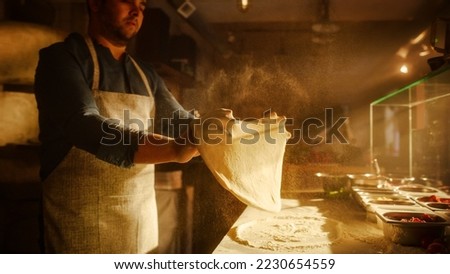 In Restaurant Professional Chef Preparing Pizza, Kneading Dough, Spinning and Tossing it, Traditional Family Recipe. Authentic Sunny Pizzeria, Cooking Delicious Organic Food. Shot Royalty-Free Stock Photo #2230654559