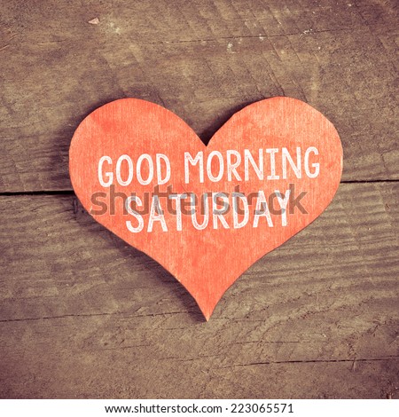 Heart with text Good morning Saturday. Heart with text Good morning Saturday on a wooden background. Vintage style.  Royalty-Free Stock Photo #223065571