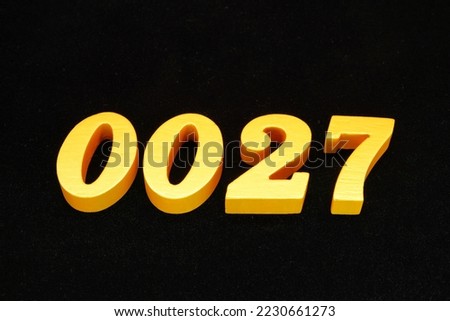   Golden Arabic numerals 0027, 1 cm thick, visible in 3D on a black velvet background.                                  