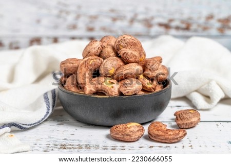Cashew nuts on wood background. Raw cashews. Healthy food. close up