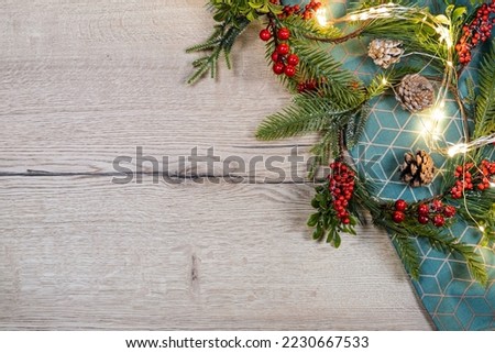 Christmas green, red, gray background. Christmas decoration and candle on cozy wooden background. High quality photo
