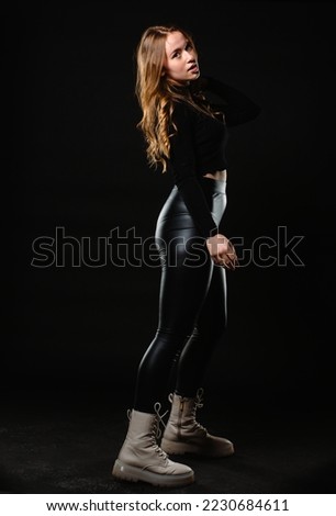 Picture of beautiful woman beautiful woman in stylish clothes on dark background