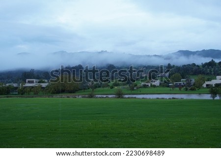 Cold day in Colombia Calera with lake and fog in mountains