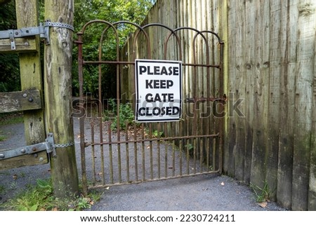 Please Keep Gates Closed Sign at iron gate in Ireland