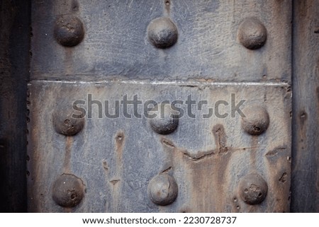 old steel beam connected with rivets