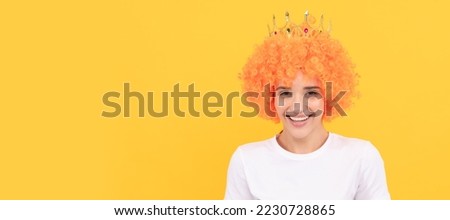happy freaky selfish woman in curly clown wig and queen crown for party, happiness. Woman isolated face portrait, banner with copy space.