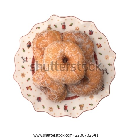 Zeppole in a Christmas plate on a white background