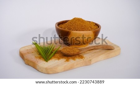 A picture of coconut brown sugar powder on the wooden bowl 