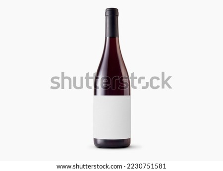 Red wine bottle with blank label on white background. Easily apply your custom design on the label.  Royalty-Free Stock Photo #2230751581