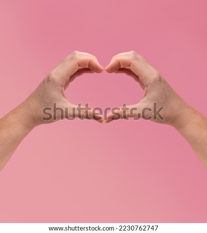 finger heart. Zoomers symbolize love. woman hand showing heart sign on pink background. International Women's Day 2024, #InspireInclusion  Royalty-Free Stock Photo #2230762747