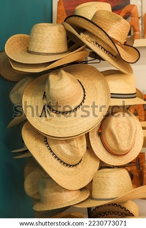 straw hats on hanger. cowboy hat