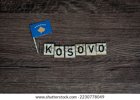 Kosovo - wooden word with kosovo flag (wooden letters, wooden sign)