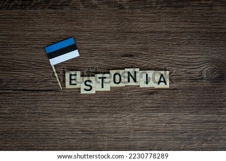 Estonia - wooden word with estonian flag (wooden letters, wooden sign)