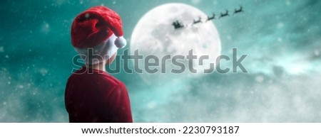 child watching santa claus arrive on christmas night