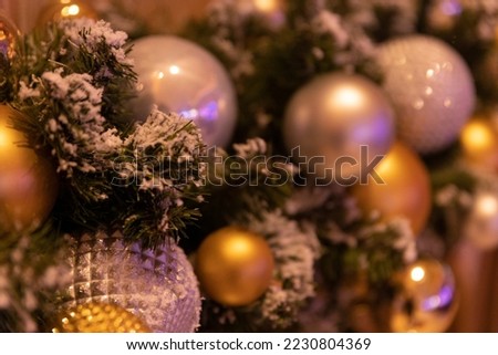 Decoration with branch of Christmas tree and balls. Shiny balls with bokeah.