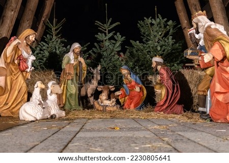 A model of the Traditional Nativity scene with a holy family in Bethlehem and the baby Jesus lying in a manger at the Christmas market. Royalty-Free Stock Photo #2230805641