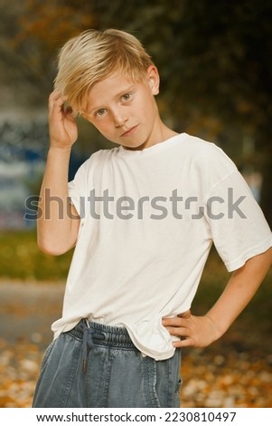 Young boy posing outdoor in skate park for book test photos