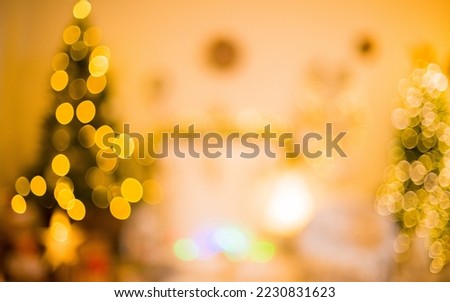 christmas lights christmas bokeh with silhouette of christmas tree and fireplace for background