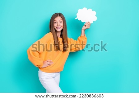 Photo of young cute little girl touch waist hold paper bubble cloud chatterbox talking phrase smiling isolated on aquamarine color background Royalty-Free Stock Photo #2230836603