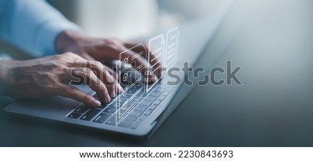 Fast checklist and clipboard task management.Business working on laptop computer productivity checklist and filling survey form online Document management concept . Royalty-Free Stock Photo #2230843693