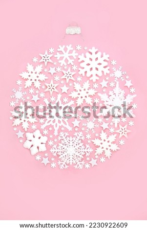 Christmas tree snowflake bauble round shape decoration on pink background. Festive ornate abstract concept for winter Xmas and New Year.