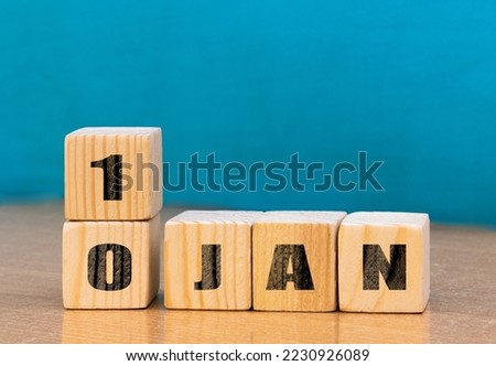 Cube shape calendar for January 10 on wooden surface with empty space for text,cube calendar for January on wood background