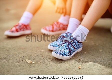 childrens feet in shoes close up. Royalty-Free Stock Photo #2230938291