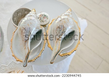 close up conch shell on table, thai wedding ceremony traditional wallpaper background
