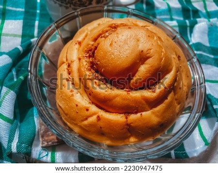 close-up photo of bread food with a variety of flavors and shapes combined with a cup of coffee which is very suitable to be served for a relaxing menu with family or alone, perfect for your inspirati